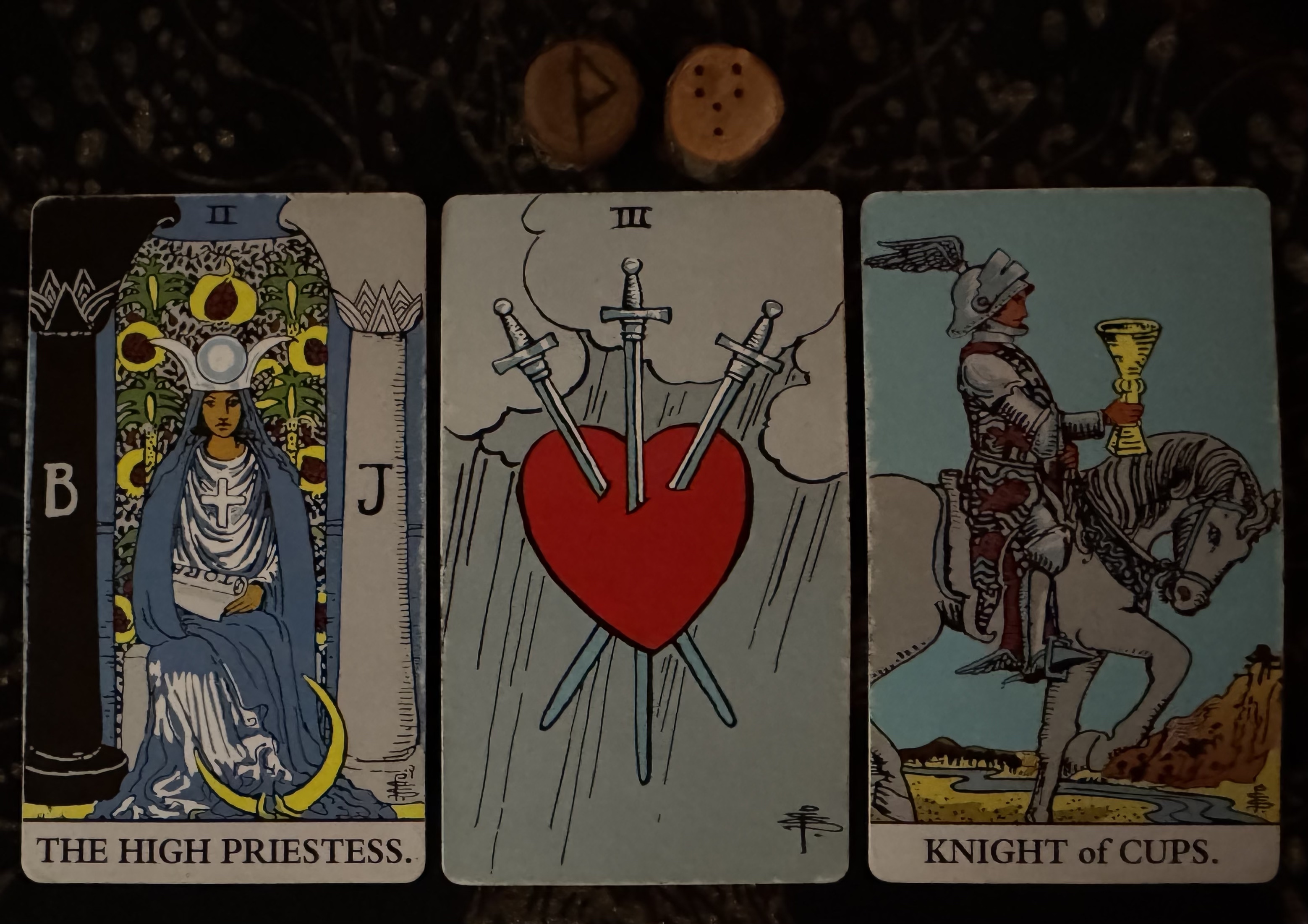 Runes: Wunjo, Fortuna Major
Cards: High Priestess, 3 of Swords, Knight of Cups