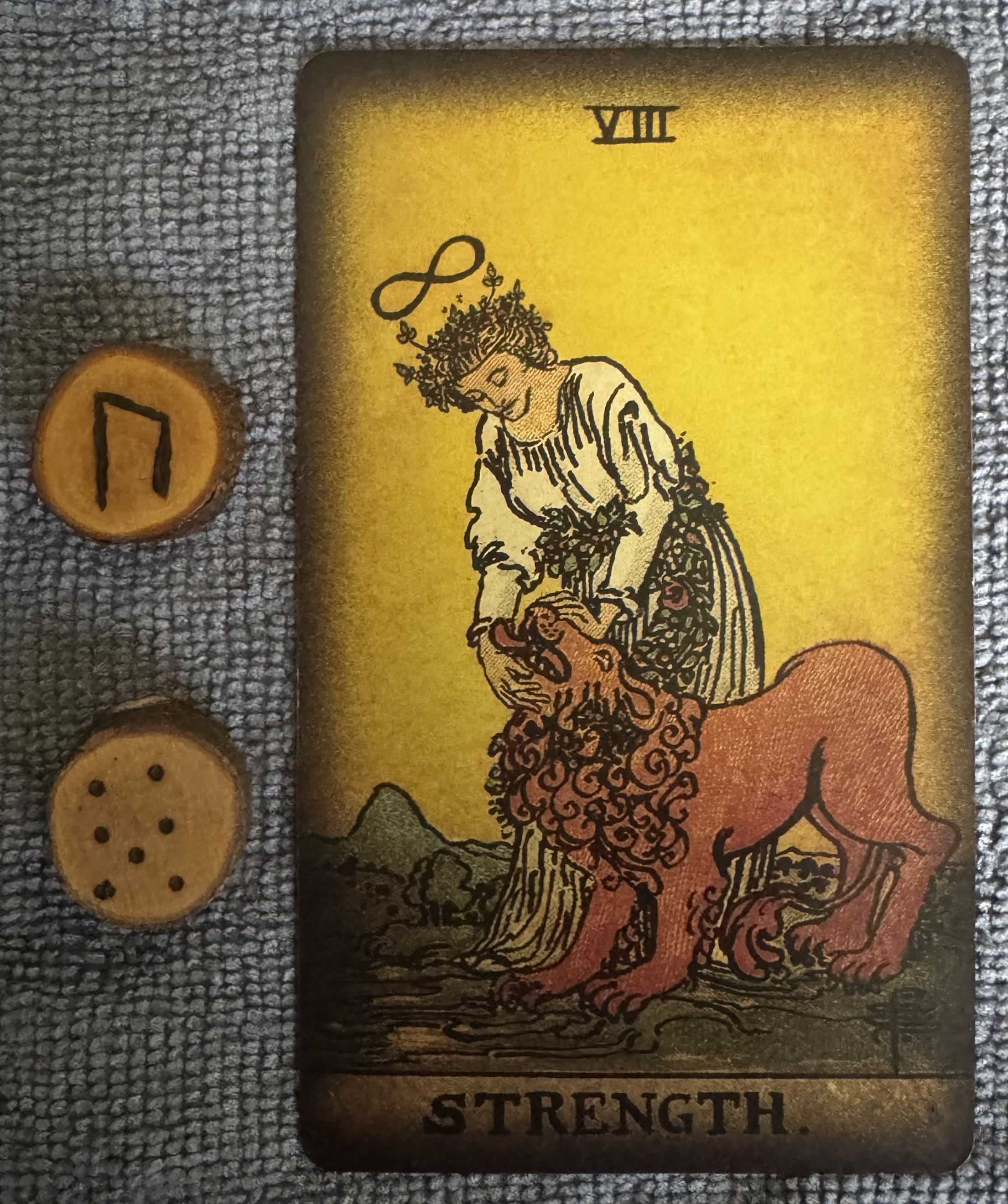 Runes: Uruz, Albus
Card: Strength